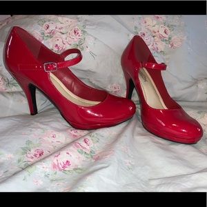 Red patent leather high heels.